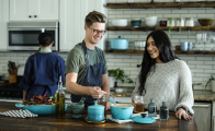 Two people cooking in a kitchen